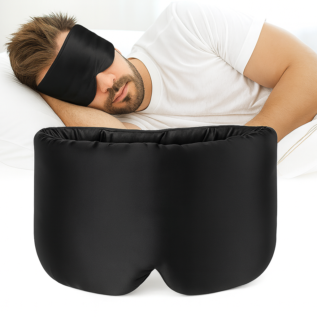 Hombre durmiendo con antifaz de seda Hipneum color Negro Obsidiana sobre almohada blanca